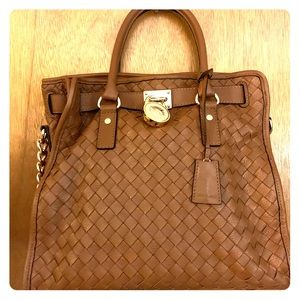 Authentic Michael Kors basket weave handbag.